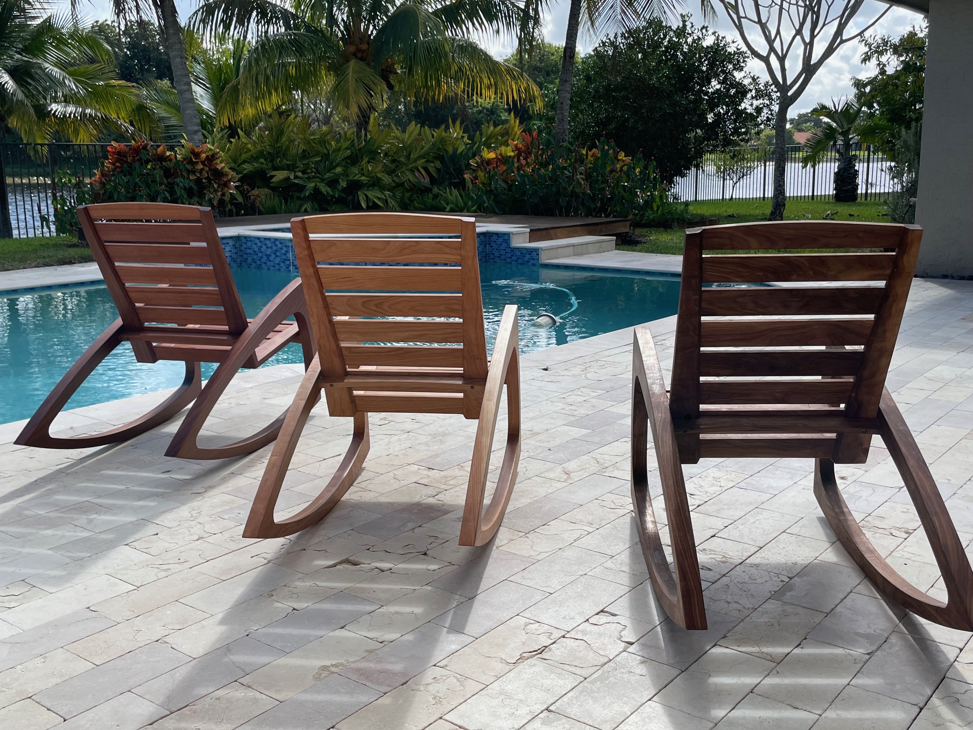 Three rocking chairs — rear view, poolside