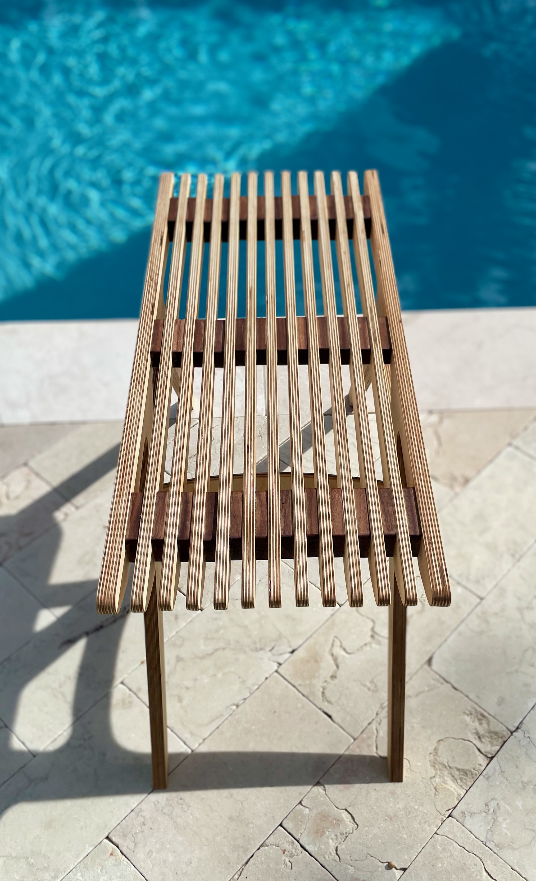 Slatted maple bench — top-down detail poolside