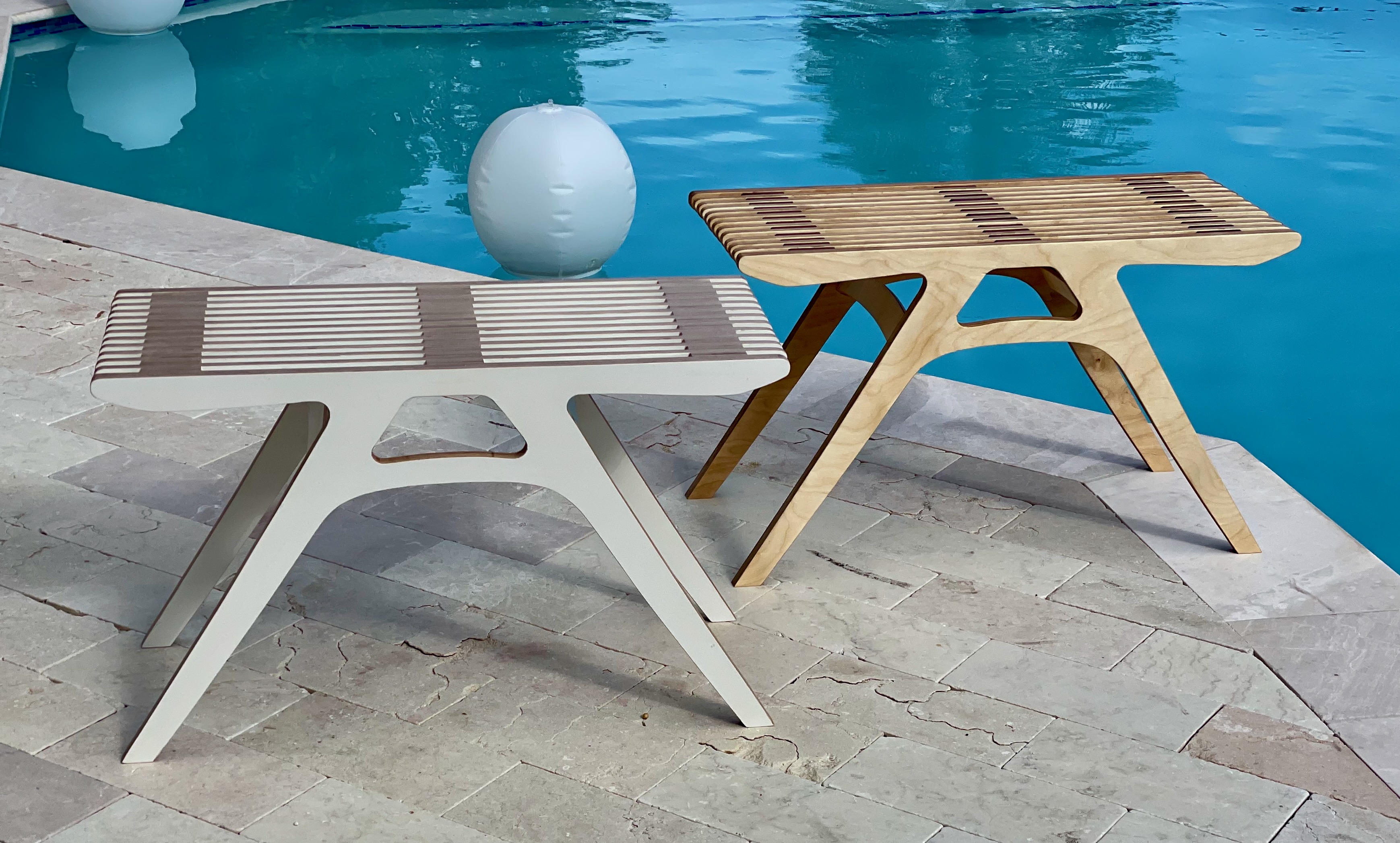 Slatted benches poolside — painted white and natural maple
