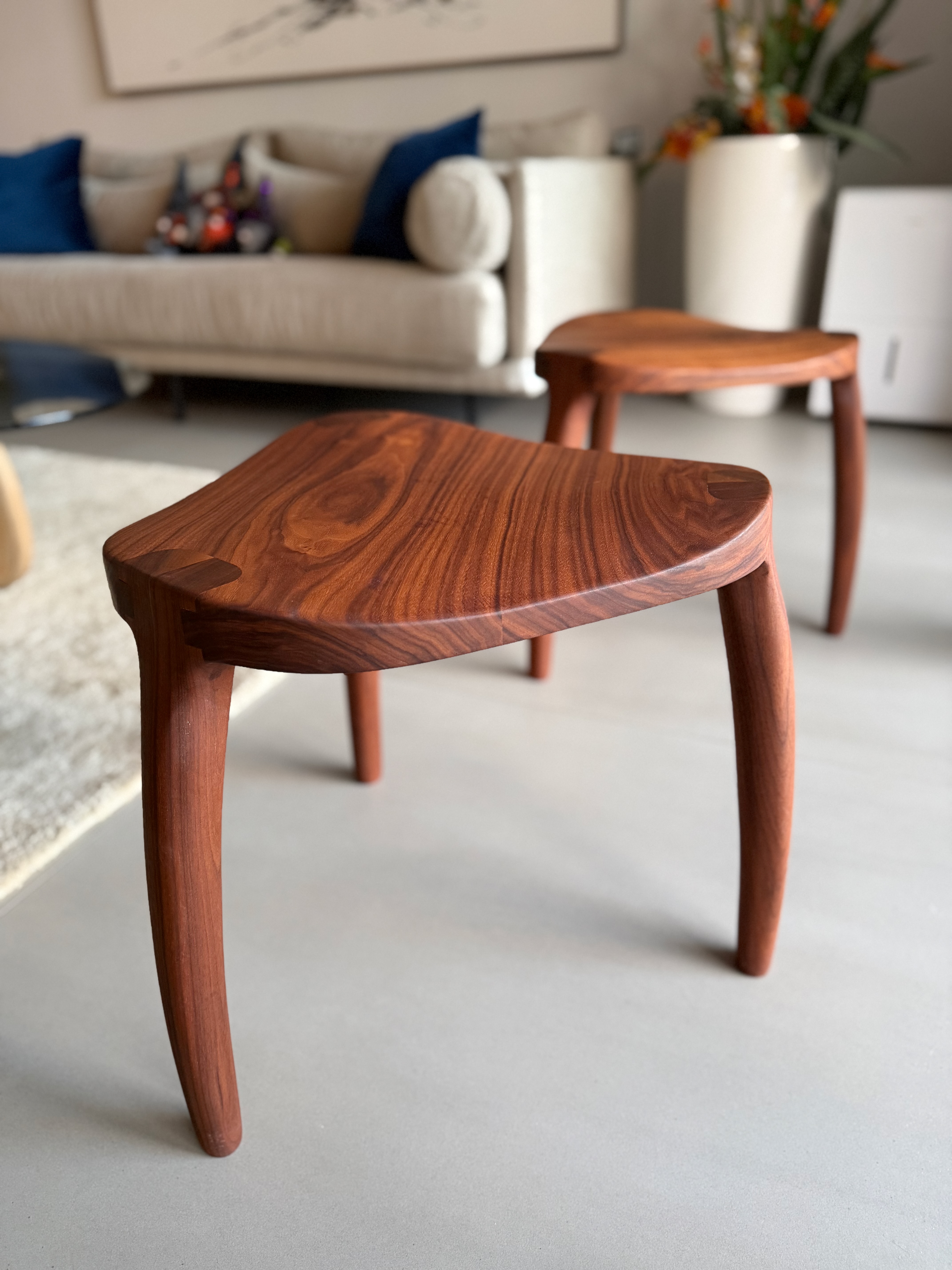 Solid walnut stools with sculpted curved legs